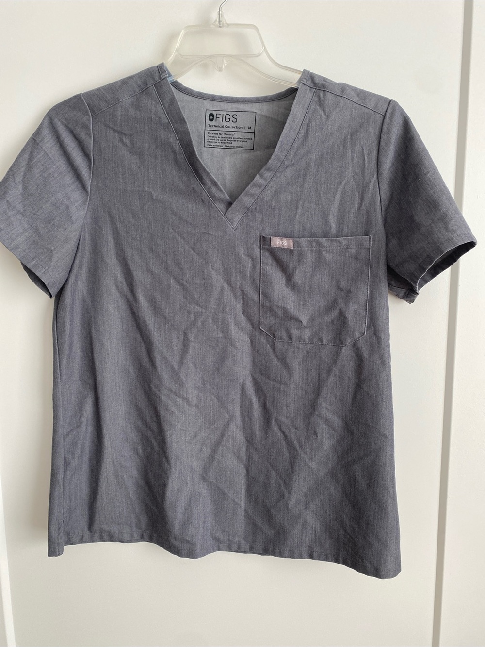 FIGS Women’s  technical collection v-Neck Scrub Top in Charcoal Gray